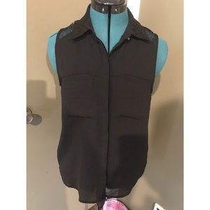 Black sleeveless blouse with lace details